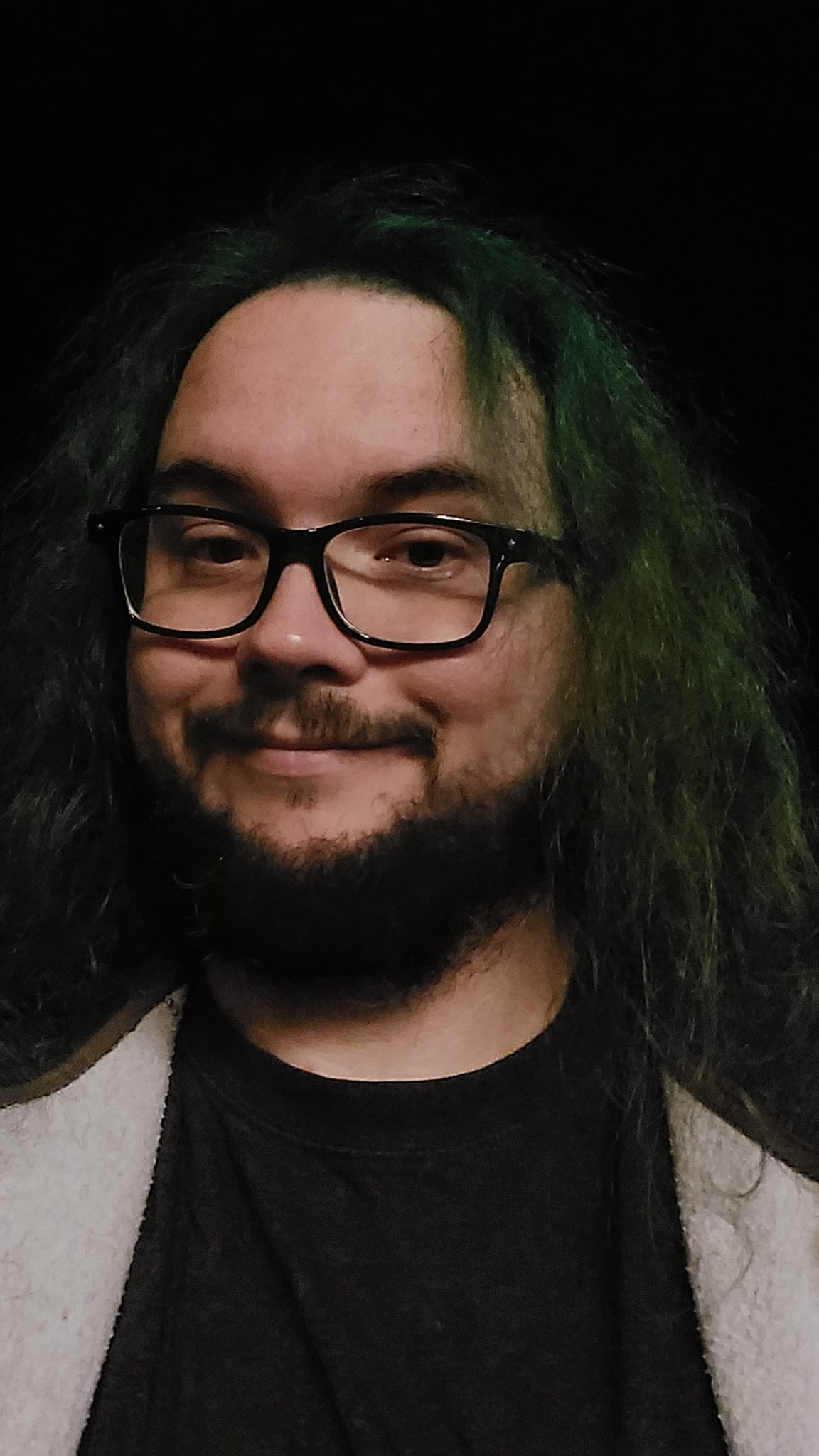 A man with green hair is at the beach after dark, photo 11